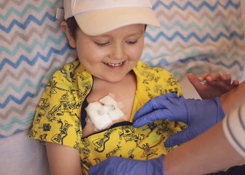 A young childhood cancer patient wearing a mediport